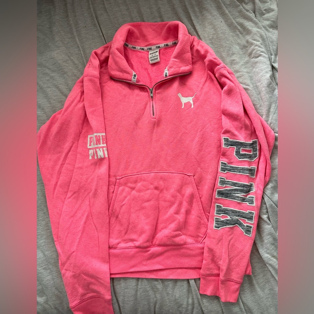 PINK quarter zip! Has graphics on the sleeves. Size Medium